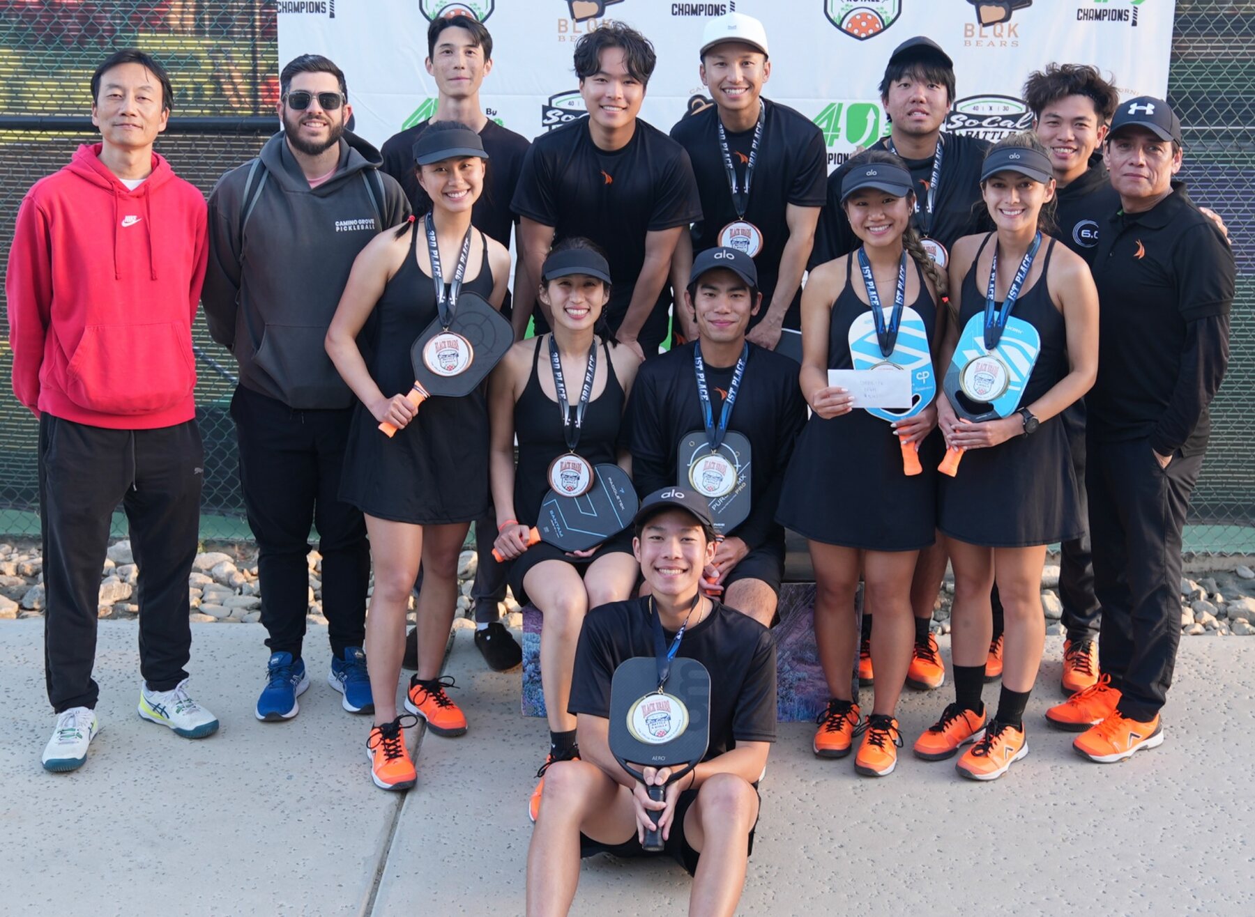 NGSG athletes and supporters celebrating medals at a team competition
