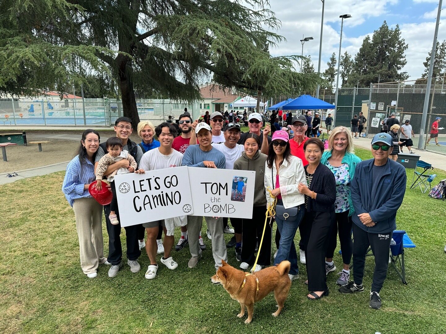 Family and friends supporting an athlete at a community tournament