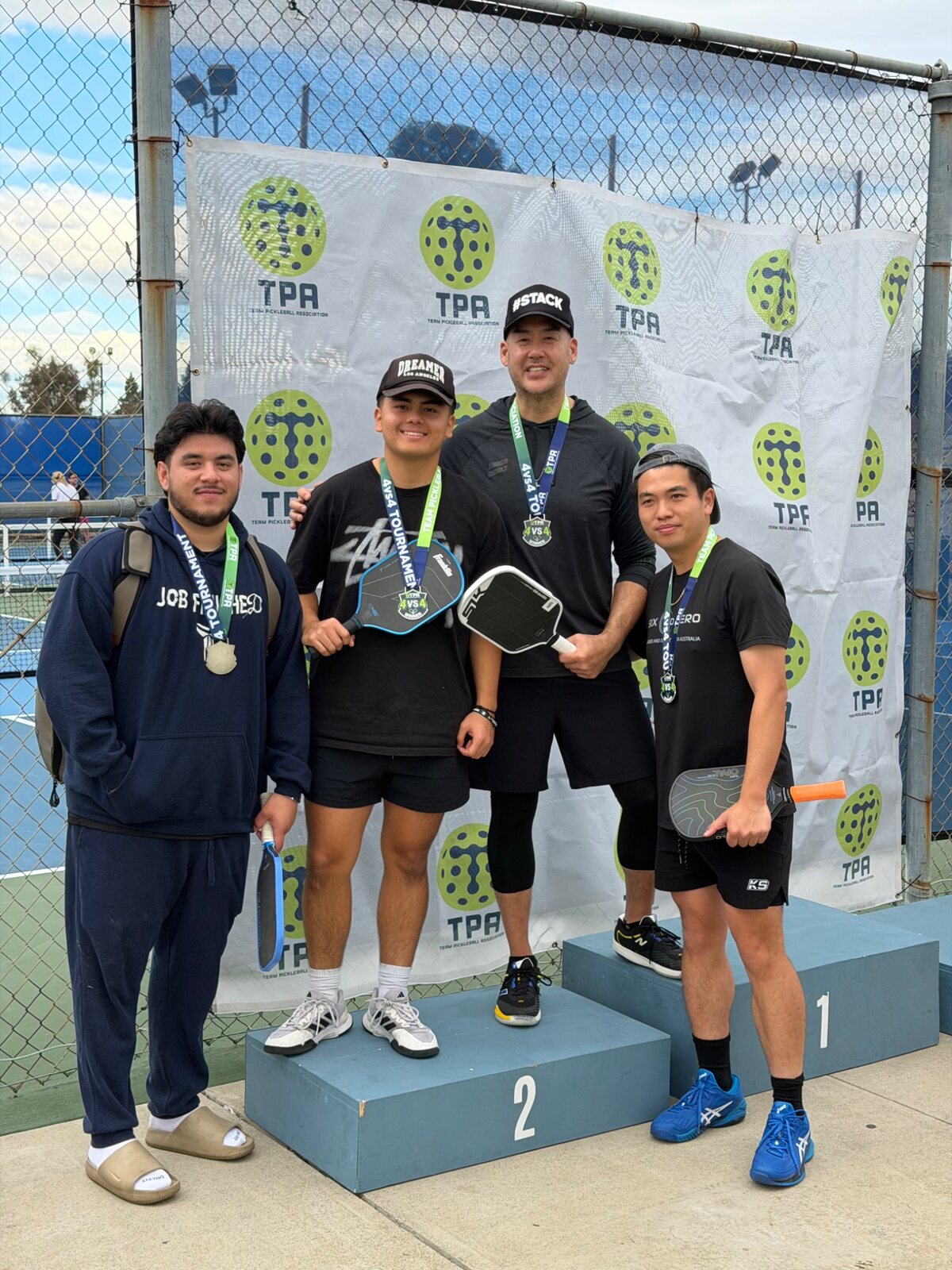 NGSG athletes celebrating together on a tournament podium